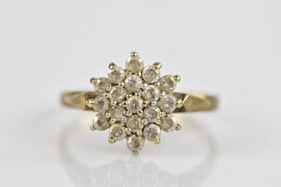 Lot 2595 - A 9ct yellow gold cluster ring set with cubic...
