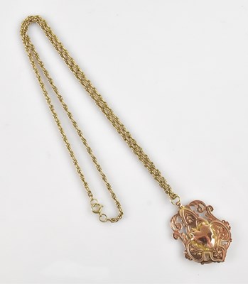 Lot 2072 - A 9ct rose gold medal, suspended on a yellow...