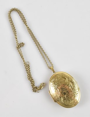 Lot 2070 - A 9ct yellow gold locket, the front panel with...