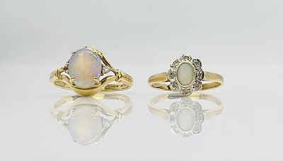 Lot 705 - Two 9ct yellow gold opal set dress rings,...