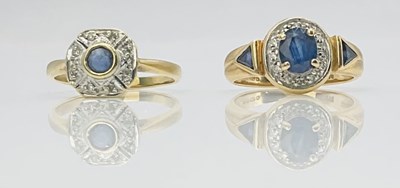 Lot 714 - A 9ct yellow gold diamond and sapphire dress...