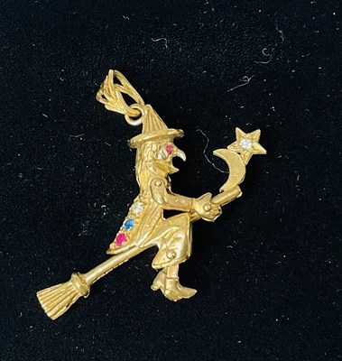 Lot 694 - An unmarked yellow metal articulated gem set...