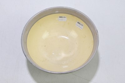 Lot 203 - CLARICE CLIFF; a circular footed bowl...