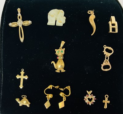 Lot 695 - A group of 9ct gold pendants comprising...