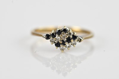 Lot 2570 - A 9ct yellow gold diamond and sapphire set...