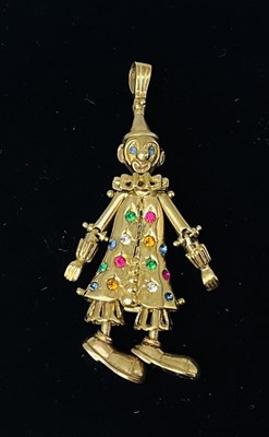Lot 658 - A yellow metal gem set clown pendant, with 9ct...