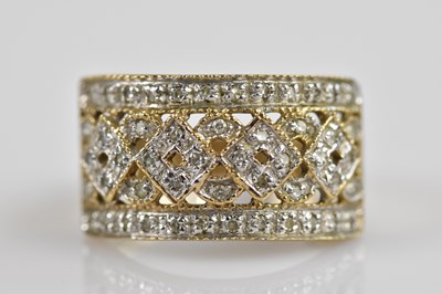 Lot 2565 - A 9ct yellow gold diamond illusion set dress...
