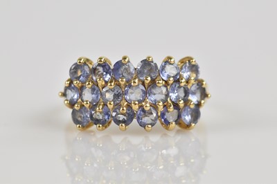 Lot 2564 - A yellow metal dress ring set with three rows...