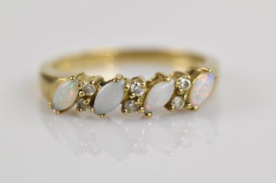 Lot 2541 - A 9ct yellow gold opal and diamond set dress...