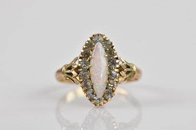 Lot 2542 - A 9ct yellow gold opal set dress ring, size K,...