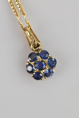 Lot 2202 - A 9ct yellow gold cluster pendant, set with...