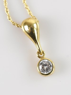 Lot 2142 - A 9ct yellow gold pendant, set with a clear...