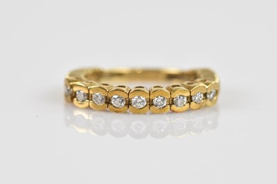 Lot 2492 - A yellow metal articulated dress ring, stamped...
