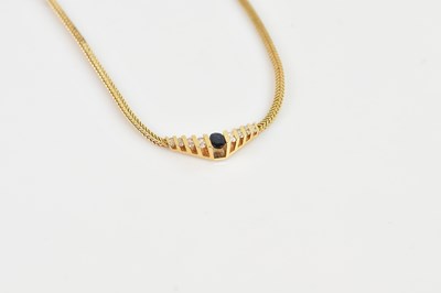 Lot 2004 - A yellow metal diamond and sapphire necklace,...