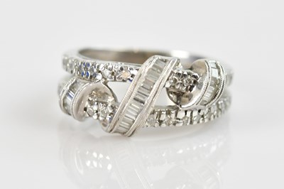 Lot 2280 - A white metal diamond set dress ring, stamped '...