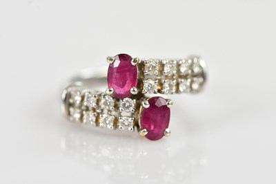 Lot 2266 - A white metal diamond and ruby set dress ring,...