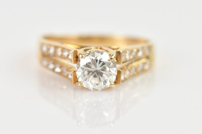 Lot 2245 - A yellow metal diamond set dress ring, stamped...