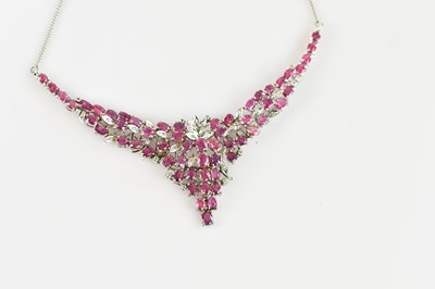 Lot 2224 - A sterling silver floral necklace set with an...