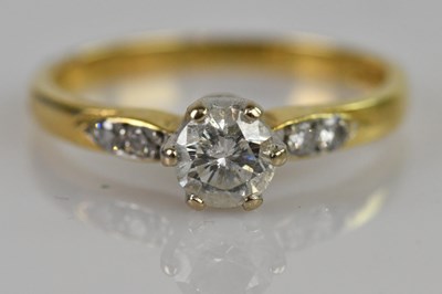 Lot 2367 - An 18ct yellow gold single stone diamond...