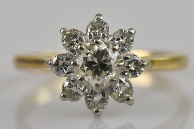 Lot 2365 - An 18ct yellow gold diamond set cluster dress...