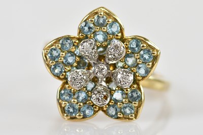 Lot 2370 - A yellow metal blue zircon and diamond set...