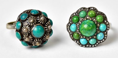 Lot 1190 - Two silver rings, each set with turquoise...