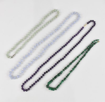 Lot 1053 - Four decorative beaded necklaces including a...