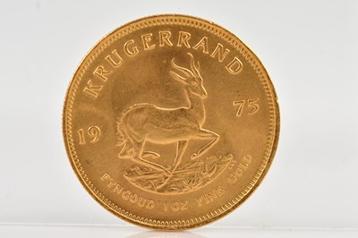 Lot 1005 - A full Krugerrand, 1975, 1oz fine gold.