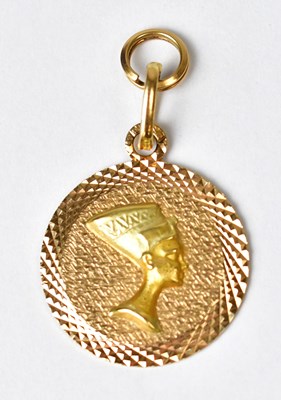 Lot 1242 - An 18ct gold charm in the form of a roundel,...
