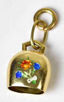 Lot 1238 - An 18ct gold charm in the form of a cow bell,...