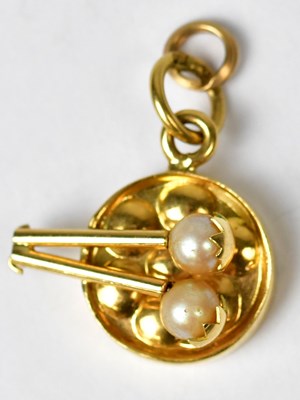 Lot 1237 - An 18ct gold charm in the form of a drum, the...