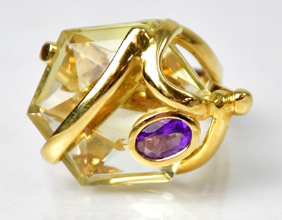 Lot 1145 - An 18ct gold cocktail ring set with a...