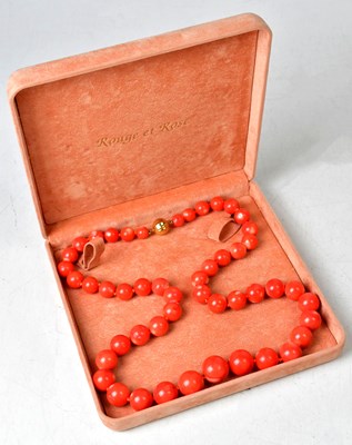Lot 1282 - A coral necklace with graduated beads, with an...