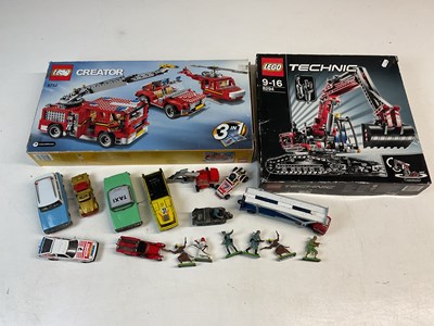 Lot 210 - LEGO; two sets of Lego and other toys,...