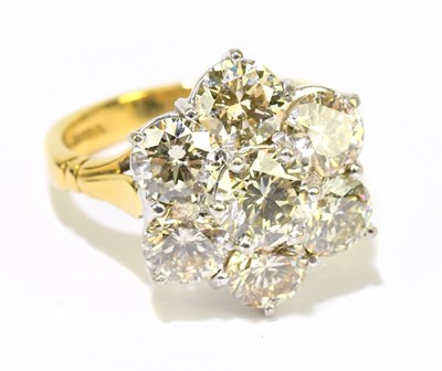 Lot 3 - An 18ct yellow gold seven stone diamond flower...