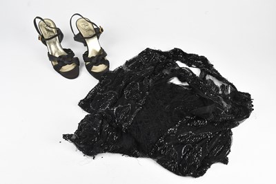 Lot 259 - A knee length black silk fully beaded 1920s...