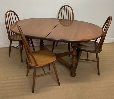 Lot 894 - ERCOL; a dining table, in dark wood stain,...
