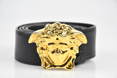 Lot 137 - VERSACE; a black leather heavy belt, stamped...