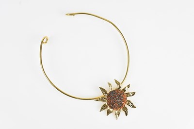 Lot 166 - YVES SAINT LAURENT; a gold tone sunflower...