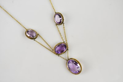 Lot 2034 - A Victorian yellow metal and amethyst necklace,...