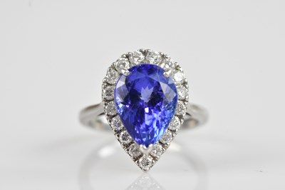 Lot 2248 - An 18ct white gold diamond and tanzanite...