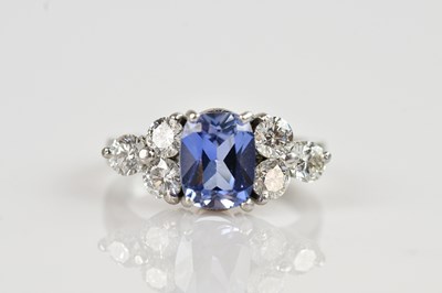 Lot 2249 - A platinum diamond and sapphire cluster ring,...