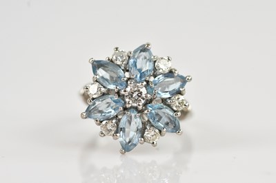 Lot 2265 - An 18ct white gold diamond and aquamarine...