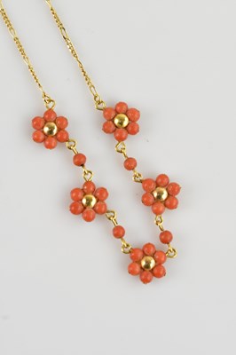 Lot 2077 - A yellow metal and coral necklace, set with...