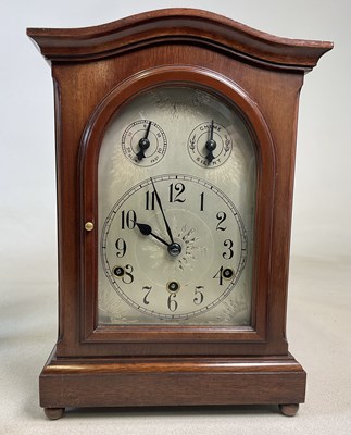 Lot 827 - A mahogany mantel clock, with Windsor chimes...