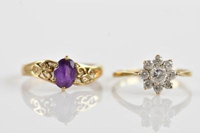 Lot 671 - A 9ct gold and white stone set flower head...