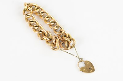 Lot 1102 - A 9ct gold textured curb link bracelet with...
