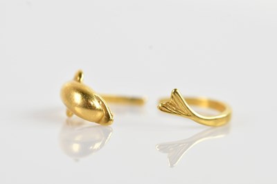 Lot 647 - A yellow metal dolphin ring, stamped ‘18ct’,...