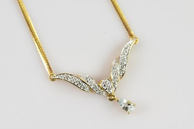 Lot 609 - A yellow metal diamond and aquamarine pendant,...