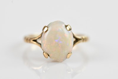 Lot 2580 - A 9ct yellow gold and opal ring, set with an...